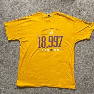 Lakers t- shirt in mens size XL., yellow front graphic, new without tags